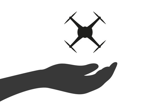 Hand hält Drohne - Kamera