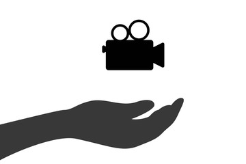 Hand hält Videokamera