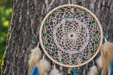 Handmade dream catcher with feathers threads and beads rope hanging