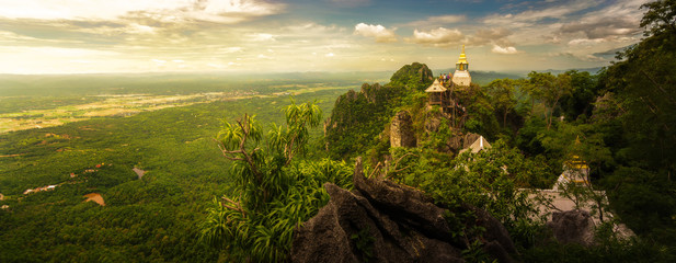 Panoramic shot : Wat Chalermprakiat Prajomklao Rachanusorn chedis on the mountain top, Lampang province, Thailand - obrazy, fototapety, plakaty