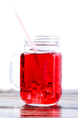 one mason jar full of lemonade isolated on white background
