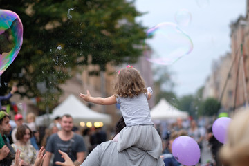 A holiday of soap bubbles in a city street. Riga, Latvia