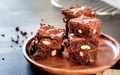 Brownie stack, closeup chocolate cake on rustic wooden table