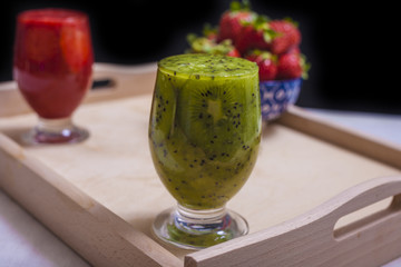Smoothies and fresh fruits on the table