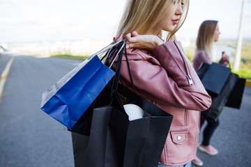 young girl standing with shopping