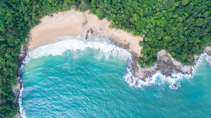 Fototapeta na wymiar Sea Aerial view, Top view,amazing nature background.The color of the water and beautifully bright.Azure beach with rocky mountains and clear water of Thailand ocean at sunny day.flying drone,sea view