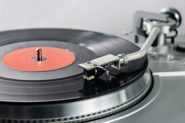 Fototapeta na wymiar Vintage record player with a vinyl record.