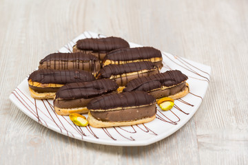 Chocolate eclairs on plate