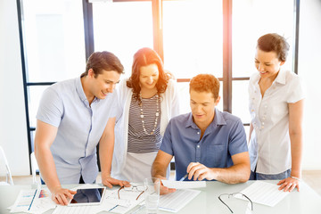 Group of happy young business people in a meeting