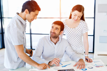 Obraz premium Group of happy young business people in a meeting