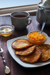 Pumpkin pancakes with honey and tea