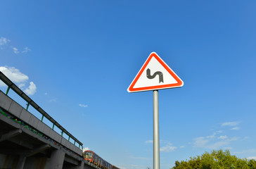 Traffic sign warning drivers of curves in the road