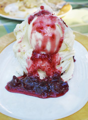 delicious dessert with ice cream and strawberry jam