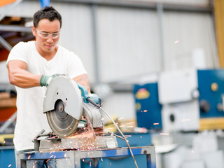 Asian worker in production plant on the factory floor