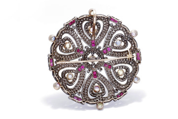 antique jewelry with diamonds, sapphires, rubies and gemstone, vintage gold clasp.