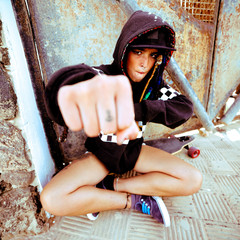 Young girl hip hop style. Urban street fashion. Skateboard life