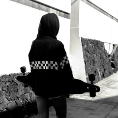 Teen girl hip hop style. Hoodie. Urban street fashion. Skateboard life