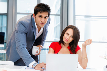 Two young business collegue in office