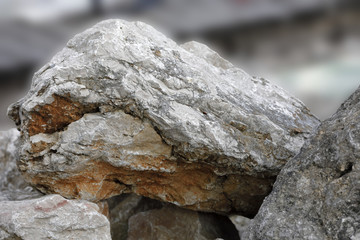 Big rocks form a cliff on the sea
