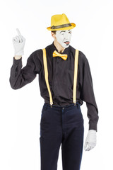 Portrait of a man, artist, clown, MIME. shows something. isolated on white background