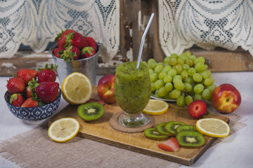 Smoothies and fresh fruits on the table