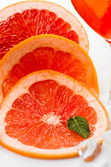 Grapefruit slice with mint and ice.