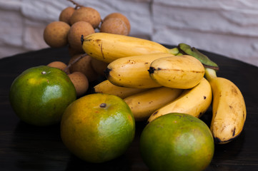 tropical fruits mandarins bananas longan