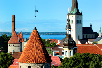 St. Olav's church and towers in the fortress wall of Old Town of Tallinn, Estonia, UNESCO World Heritage site and popular tourist destination.
