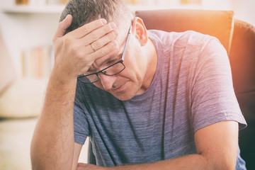 Fototapeta premium Tired businessman at home office