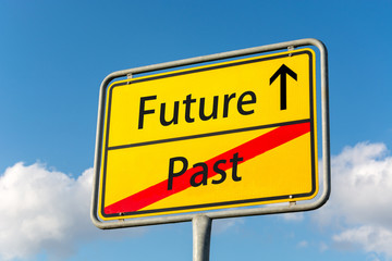 Yellow street sign with future ahead leaving the past behind