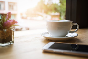 Coffee cup display on wooden table.