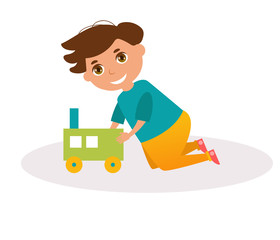 Boy plays with a wooden train