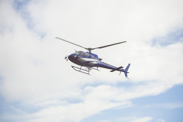 Fototapeta na wymiar blue helicopter in the sky