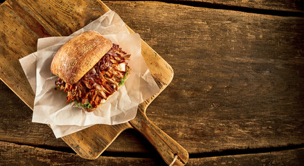 Baked sandwich with meat prepared on cutting board