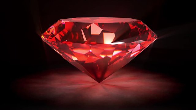 Spining perfect ruby isolated on black background.
