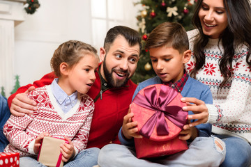 family with christmas presents