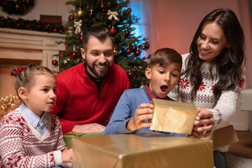 family with christmas presents