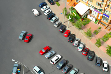 Parked cars near multistorey building