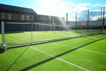 Foto op Canvas Beautiful tennis court on sunny day © Africa Studio