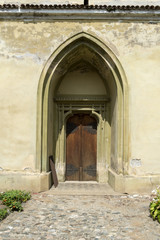 Arched door in an old stone building