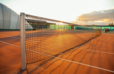 Beautiful tennis court at sunset