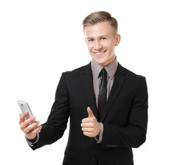 Young businessman with phone on white background