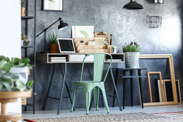 Green chair in designer's room