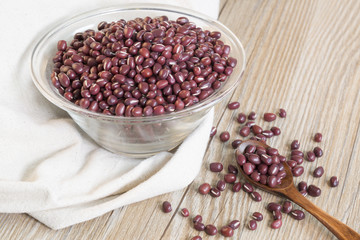 Red beans in a glass bowl on the table.