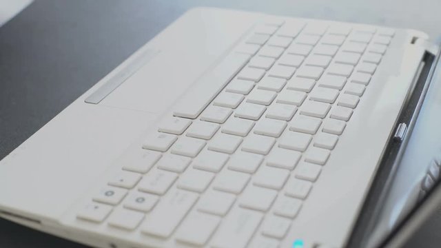 Taping on Laptop keyboard. Financial Strategy | Analysis of the Crypto-Currency Transactions