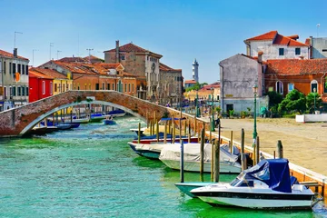 Zelfklevend Fotobehang View of the colorful Venetian houses along the canal at the Islands of Murano in Venice. © Javen