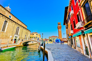 View of the colorful Venetian houses along the canal at the Islands of Murano in Venice.