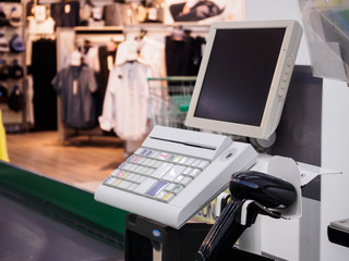 supermarket cash desk checkout counter payment terminal with blank computer monitor screen