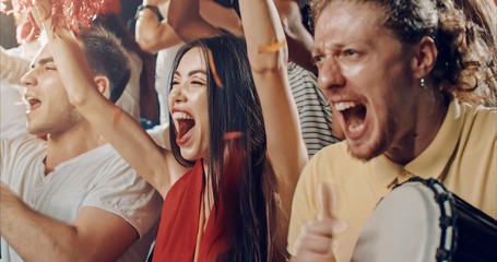 Fans cheering for sports team