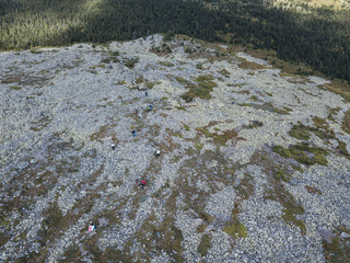 a group of people go up the slope mountain Iremel. Aerial view